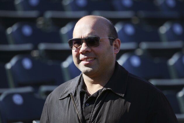San Francisco Giants president of baseball operations Farhan Zaidi smiles as he walks on the field during spring training baseball workouts for pitchers and catchers Wednesday, Feb. 12, 2020, in Scottsdale, Ariz. (AP Photo/Ross D. Franklin)