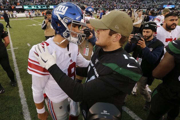 EAST RUTHERFORD, NEW JERSEY - NOVEMBER 10:   (NEW YORK DAILIES OUT)   Daniel Jones #8 of the New York Giants and Sam Darnold #14 of the New York Jets meet after their game at MetLife Stadium on November 10, 2019 in East Rutherford, New Jersey. The Jets defeated the Giants 34-27. (Photo by Jim McIsaac/Getty Images)