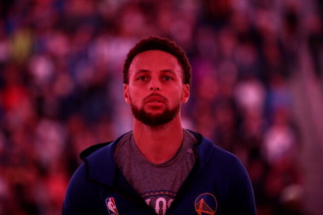SAN FRANCISCO, CALIFORNIA - MARCH 05:  Stephen Curry #30 of the Golden State Warriors stands for the Canadian National Anthem before their game against the Toronto Raptors at Chase Center on March 05, 2020 in San Francisco, California.  NOTE TO USER: User expressly acknowledges and agrees that, by downloading and or using this photograph, User is consenting to the terms and conditions of the Getty Images License Agreement.  (Photo by Ezra Shaw/Getty Images)