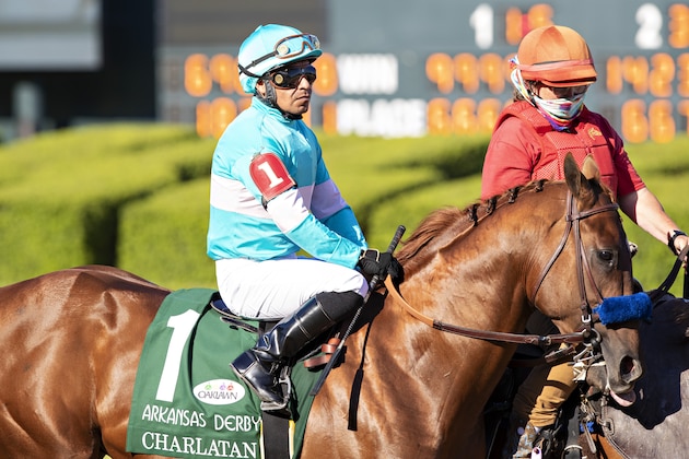 HOT SPRINGS, AR - MAY 02: Winner #1 Charlatan, with Jockey Martin Garcia, parades by the grandstands with no fans before the start of the The Arkansas Derby (Grade 1) during the Covid-19 Pandemic on Derby Day at Oaklawn Racing Casino Resort on May 2, 2020 in Hot Springs, Arkansas. (Photo by Wesley Hitt/Getty Images) HOT SPRINGS, AR - MAY 02: Winner #1 Charlatan, with Jockey Martin Garcia, parades by the grandstands with no fans before the start of the The Arkansas Derby (Grade 1) during the Covid-19 Pandemic on Derby Day at Oaklawn Racing Casino Resort on May 2, 2020 in Hot Springs, Arkansas. (Photo by Wesley Hitt/Getty Images)