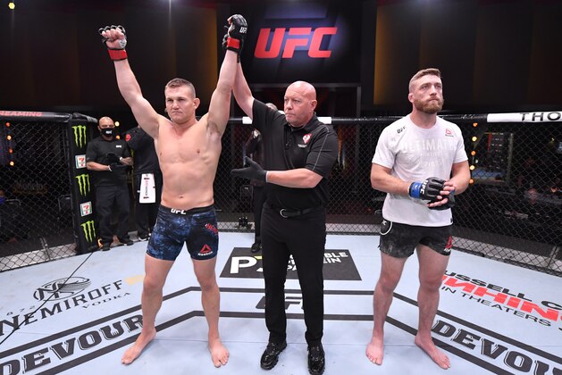 LAS VEGAS, NEVADA - JUNE 06: In this handout image provided by UFC, Ian Heinisch celebrates after his knockout victory over Gerald Meerschaert in their middleweight bout during the UFC 250 event at UFC APEX on June 06, 2020 in Las Vegas, Nevada. (Photo by Jeff Bottari/Zuffa LLC via Getty Images)
