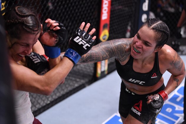 LAS VEGAS, NEVADA - JUNE 06: (R-L) Amanda Nunes of Brazil punches Felicia Spencer of Canada in their UFC featherweight championship bout during the UFC 250 event at UFC APEX on June 06, 2020 in Las Vegas, Nevada. (Photo by Jeff Bottari/Zuffa LLC)