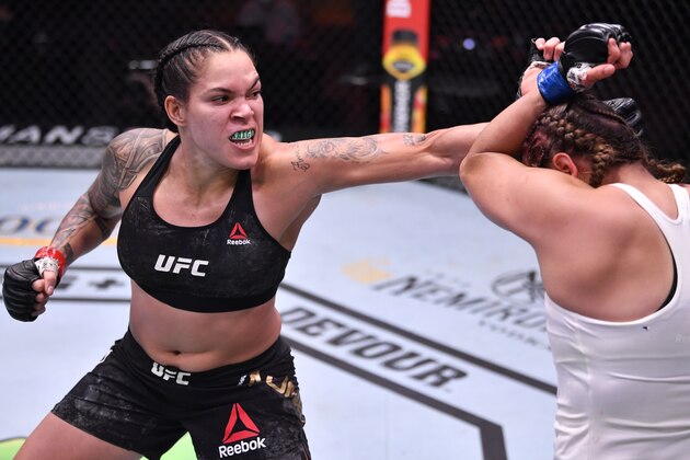 LAS VEGAS, NEVADA - JUNE 06: In this handout provided by UFC, (L-R) Amanda Nunes of Brazil punches Felicia Spencer of Canada in their UFC featherweight championship bout during the UFC 250 event at UFC APEX on June 06, 2020 in Las Vegas, Nevada. (Photo by Jeff Bottari/Zuffa LLC via Getty Images)