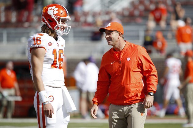 TALLAHASSEE, FL - OCTOBER 27: Head coach Dabo Swinney of the Clemson Tigers talks with quarterback Trevor Lawrence #16 before the game against the Florida State Seminoles at Doak Campbell Stadium on October 27, 2018 in Tallahassee, Florida. Clemson won 59-10. (Photo by Joe Robbins/Getty Images)