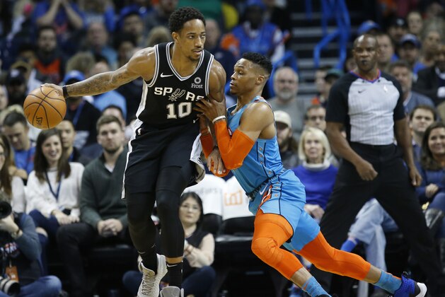 San Antonio Spurs guard DeMar DeRozan (10) drives against Oklahoma City Thunder guard Russell Westbrook, right, during an NBA basketball game between the San Antonio Spurs and the Oklahoma City Thunder in Oklahoma City, Saturday, Jan. 12, 2019. (AP Photo/Sue Ogrocki)