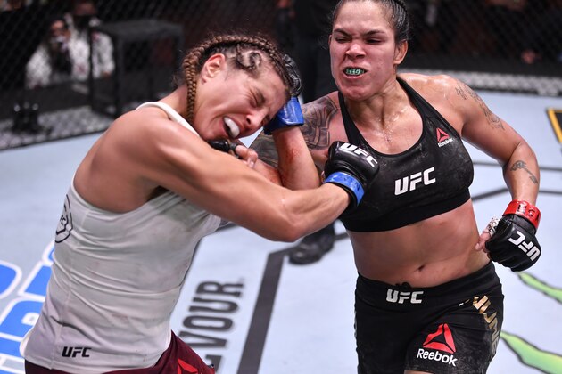 LAS VEGAS, NEVADA - JUNE 06: (R-L) Amanda Nunes of Brazil punches Felicia Spencer of Canada in their UFC featherweight championship bout during the UFC 250 event at UFC APEX on June 06, 2020 in Las Vegas, Nevada. (Photo by Jeff Bottari/Zuffa LLC)