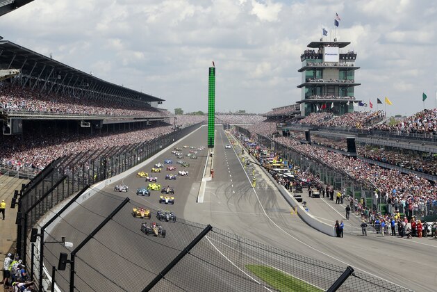 FILE - In this May 29, 2016, file photo, James Hinchcliffe, of Canada, leads the field into the first turn on the start of the 100th running of the Indianapolis 500 auto race at Indianapolis Motor Speedway in Indianapolis. Indianapolis Motor Speedway president Doug Boles had a very real fear following last year's 100th edition of the Indy 500: That many in the record-setting crowd packing his track last May would decide to be FILE - In this May 29, 2016, file photo, James Hinchcliffe, of Canada, leads the field into the first turn on the start of the 100th running of the Indianapolis 500 auto race at Indianapolis Motor Speedway in Indianapolis. Indianapolis Motor Speedway president Doug Boles had a very real fear following last year's 100th edition of the Indy 500: That many in the record-setting crowd packing his track last May would decide to be