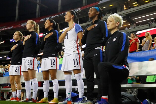 ATLANTA, GA - SEPTEMBER 18: Megan Rapinoe #15 kneels during the National Anthem prior to the match between the United States and the Netherlands at Georgia Dome on September 18, 2016 in Atlanta, Georgia. (Photo by Kevin C. Cox/Getty Images) ATLANTA, GA - SEPTEMBER 18: Megan Rapinoe #15 kneels during the National Anthem prior to the match between the United States and the Netherlands at Georgia Dome on September 18, 2016 in Atlanta, Georgia. (Photo by Kevin C. Cox/Getty Images)