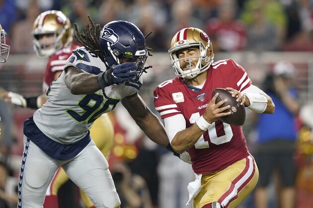 FILE - In this Nov. 11, 2019, file photo, Seattle Seahawks defensive end Jadeveon Clowney (90) applies pressure to San Francisco 49ers quarterback Jimmy Garoppolo (10) during an NFL football game in Santa Clara, Calif. Seattle made a couple of additions bringing back Bruce Irvin and Benson Mayowa in free agency. But with continued uncertainty about Clowney, the pass rush must be a priority in the upcoming draft. (AP Photo/Tony Avelar, File)