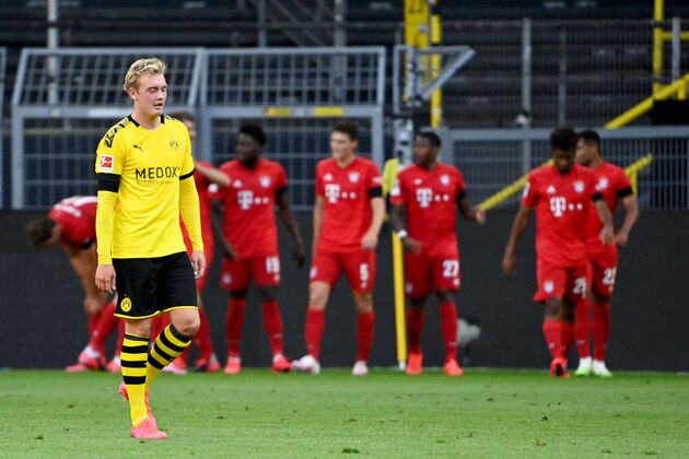 DORTMUND, GERMANY - MAY 26: Julian Brandt of Borussia Dortmund reacts to Bayern Munich scoring there first goal during the Bundesliga match between Borussia Dortmund and FC Bayern Muenchen at Signal Iduna Park on May 26, 2020 in Dortmund, Germany. (Photo by Federico Gambarini/Pool via Getty Images)