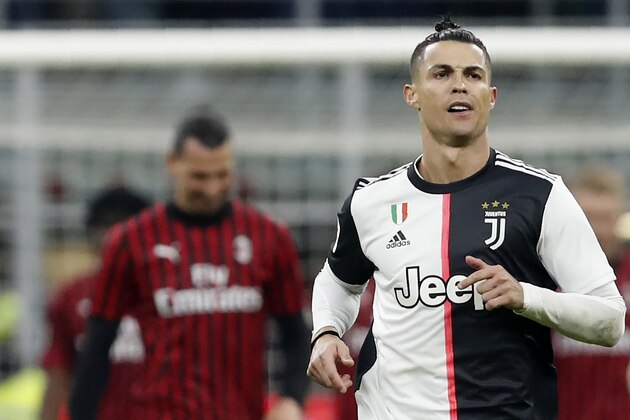 Juventus' Cristiano Ronaldo celebrates after scoring with penalty against AC Milan during an Italian Cup soccer match between AC Milan and Juventus at the San Siro stadium, in Milan, Italy, Thursday, Feb. 13, 2020. AC Milan's Zlatan Ibrahimovic is seen in the background. (AP Photo/Antonio Calanni) Juventus' Cristiano Ronaldo celebrates after scoring with penalty against AC Milan during an Italian Cup soccer match between AC Milan and Juventus at the San Siro stadium, in Milan, Italy, Thursday, Feb. 13, 2020. AC Milan's Zlatan Ibrahimovic is seen in the background. (AP Photo/Antonio Calanni)