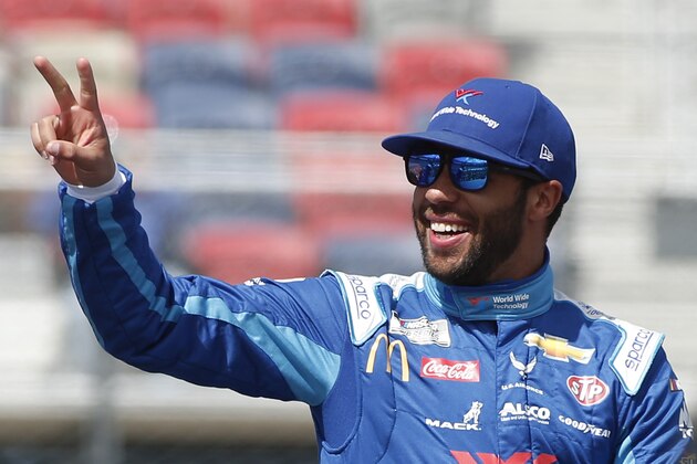 Bubba Wallace waves to fans during driver introductions prior to the NASCAR Cup Series auto race at Phoenix Raceway, Sunday, March 8, 2020, in Avondale, Ariz. (AP Photo/Ralph Freso) Bubba Wallace waves to fans during driver introductions prior to the NASCAR Cup Series auto race at Phoenix Raceway, Sunday, March 8, 2020, in Avondale, Ariz. (AP Photo/Ralph Freso)