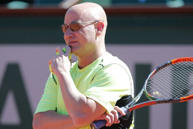 Andre Agassi, of the U.S, coach of defending champion Serbia's Novak Djokovic attends a training session for the French Open tennis tournament at the Roland Garros stadium, Friday, May 26, 2017 in Paris. (AP Photo/Christophe Ena)