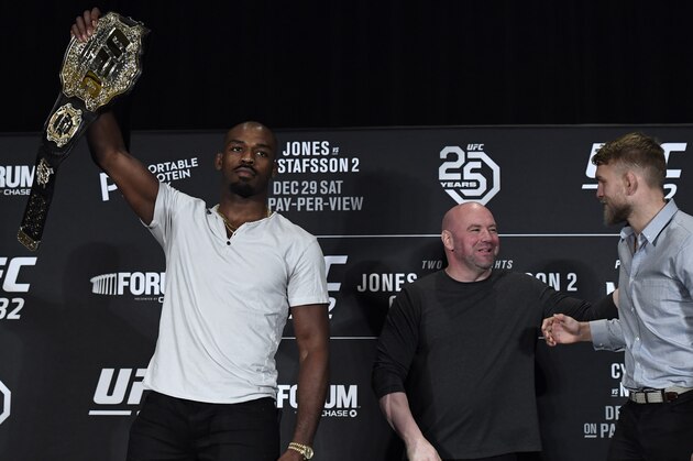 LOS ANGELES, CA - DECEMBER 27: Jon Jones (L) holds up the belt as he poses for the media with UFC President Dana White and opponent Alexander Gustafsson of Sweden looking on during the UFC 232 press conference on December 27, 2018 in Los Angeles, California. (Photo by Kevork Djansezian/Zuffa LLC/Zuffa LLC)