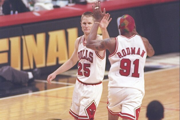 13 Jun 1997: Guard Shandon Anderson of the Utah Jazz watches as guard Steve Kerr #25 and forward Dennis Rodman #91 of the Chicago Bulls high five each other during game 6 of the 1997 NBA Finals at the United Center in Chicago, Illinois. The Bulls defeated the Jazz 90-86 to win the series and claim the championship.