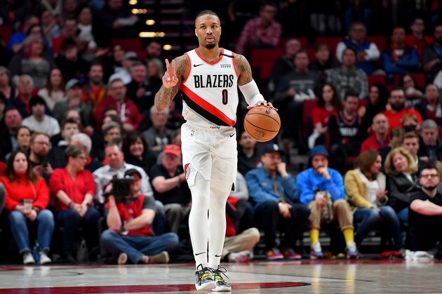 PORTLAND, OREGON - MARCH 07: Damian Lillard #0 of the Portland Trail Blazers sets the play during the first half of the game against the Sacramento Kings at the Moda Center on March 07, 2020 in Portland, Oregon. NOTE TO USER: User expressly acknowledges and agrees that, by downloading and or using this photograph, User is consenting to the terms and conditions of the Getty Images License Agreement. (Photo by Alika Jenner/Getty Images)