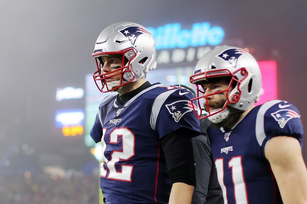 FOXBOROUGH, MASSACHUSETTS - JANUARY 04: Tom Brady #12 of the New England Patriots and Julian Edelman #11 look on after Edelman scored a touchdown in the second quarter of the AFC Wild Card Playoff game at Gillette Stadium on January 04, 2020 in Foxborough, Massachusetts. (Photo by Maddie Meyer/Getty Images)