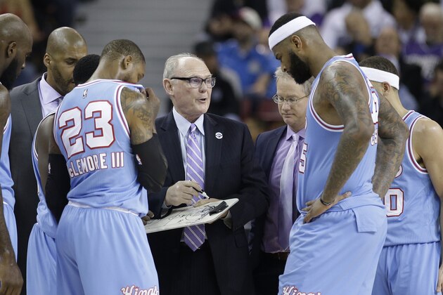 In this photo taken Saturday April 9, 2016, Sacramento Kings head coach George Karl, center, huddles with team members Ben McLemore, left, and DeMarcus Cousins, right, during the second half of an NBA basketball game against the Oklahoma City Thunder in Sacramento, Calif. Karl will not be retained as head coach of the Kings according to a statement released by the team Thursday April 14, 2016. (AP Photo/Rich Pedroncelli)