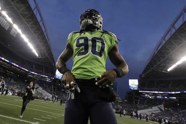 Seattle Seahawks defensive end Jadeveon Clowney stands on the field before an NFL football game against the Minnesota Vikings, Monday, Dec. 2, 2019, in Seattle. (AP Photo/Ted S. Warren)
