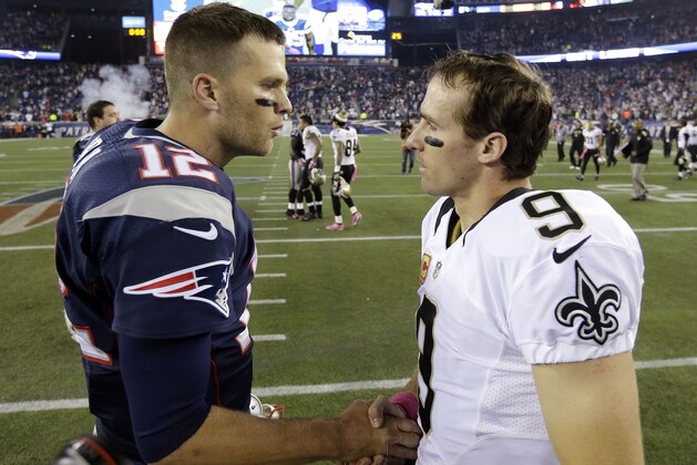 New England Patriots quarterback Tom Brady, left, talks with New Orleans Saints quarterback Drew Brees after the Patriots beat the Saints 30-27 in an NFL football game Sunday, Oct.13, 2013, in Foxborough, Mass. (AP Photo/Steven Senne)