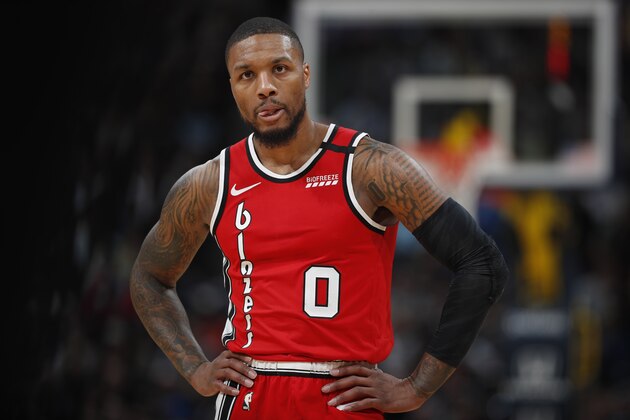 Portland Trail Blazers guard Damian Lillard (0) in the second half of an NBA basketball game Tuesday, Feb. 4, 2020, in Denver. The Nuggets won 127-99. (AP Photo/David Zalubowski) Portland Trail Blazers guard Damian Lillard (0) in the second half of an NBA basketball game Tuesday, Feb. 4, 2020, in Denver. The Nuggets won 127-99. (AP Photo/David Zalubowski)