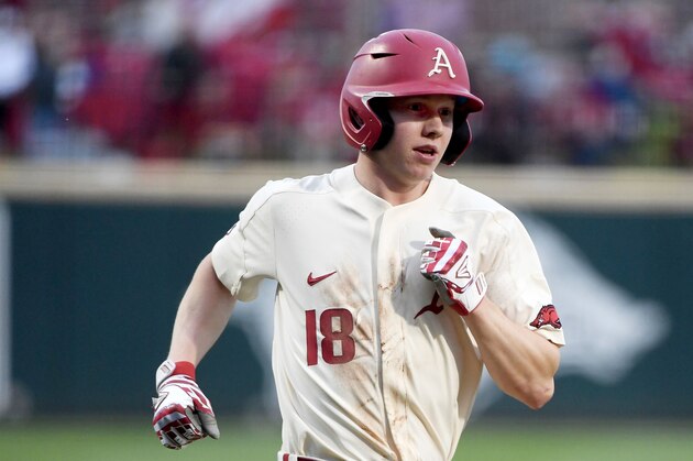 Arkansas baserunner Heston Kjerstad scores a run against Arkansas Pine Bluff during an NCAA college baseball game, Tuesday, April 16, 2019, in Fayetteville, Ark. (AP Photo/Michael Woods)