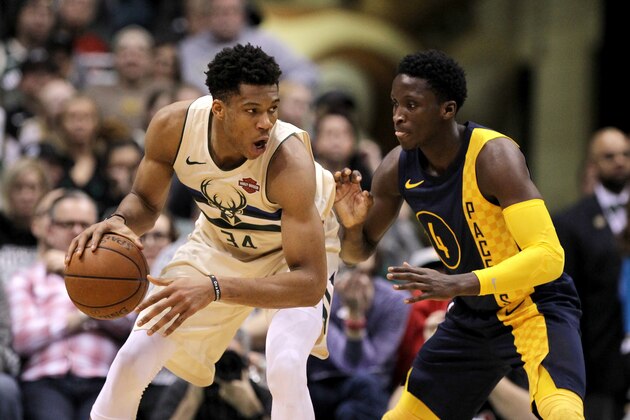 MILWAUKEE, WI - MARCH 02:  Giannis Antetokounmpo #34 of the Milwaukee Bucks dribbles the ball while being guarded by Victor Oladipo #4 of the Indiana Pacers in the fourth quarter at the Bradley Center on March 2, 2018 in Milwaukee, Wisconsin. NOTE TO USER: User expressly acknowledges and agrees that, by downloading and or using this photograph, User is consenting to the terms and conditions of the Getty Images License Agreement. (Photo by Dylan Buell/Getty Images)