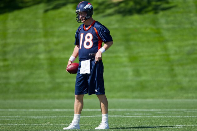 ENGLEWOOD, CO - MAY 21: Quarterback Peyton Manning #18 of the Denver Broncos looks on during organized team activities at Dove Valley on May 21, 2012 in Englewood, Colorado. (Photo by Justin Edmonds/Getty Images) ENGLEWOOD, CO - MAY 21: Quarterback Peyton Manning #18 of the Denver Broncos looks on during organized team activities at Dove Valley on May 21, 2012 in Englewood, Colorado. (Photo by Justin Edmonds/Getty Images)