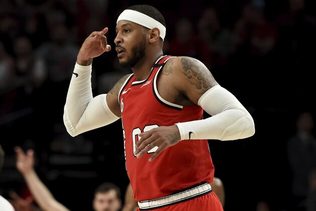 Portland Trail Blazers forward Carmelo Anthony reacts after making a shot during the second half of the team's NBA basketball game against the Phoenix Suns in Portland, Ore., Tuesday, March 10, 2020. The Blazers won 121-105. (AP Photo/Steve Dykes)