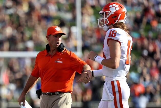 WINSTON SALEM, NC - OCTOBER 06:  Head coach Dabo Swinney of the Clemson Tigers celebrates a touchdown with Trevor Lawrence #16 of the Clemson Tigers during their game at BB&T Field on October 6, 2018 in Winston Salem, North Carolina.  (Photo by Streeter Lecka/Getty Images)