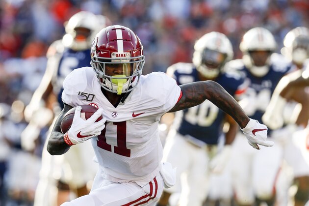 Alabama wide receiver Henry Ruggs III (11) caries the ball against Auburn during an NCAA college football game Saturday, Nov. 30, 2019, in Auburn, Ala. (AP Photo/Butch Dill)
