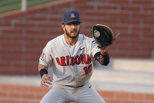 FILE - In this April 9, 2019, file photo, Arizona first baseman Austin Wells catches a throw during the team's NCAA college baseball game against Grand Canyon in Phoenix. The New York Yankees selected Wells in the first round of the baseball draft Wednesday, June 10, 2020. (AP Photo/Rick Scuteri, File)