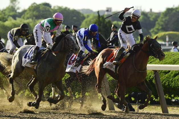 Jockey Joel Rosario, atop Sir Winston (7), right, reacts as after crossing the finish line ahead of Tacitus (10), with jockey Jose Ortiz up, to win the 151st running of the Belmont Stakes horse race, Saturday, June 8, 2019, in Elmont, N.Y. (AP Photo/Steven Ryan) Jockey Joel Rosario, atop Sir Winston (7), right, reacts as after crossing the finish line ahead of Tacitus (10), with jockey Jose Ortiz up, to win the 151st running of the Belmont Stakes horse race, Saturday, June 8, 2019, in Elmont, N.Y. (AP Photo/Steven Ryan)
