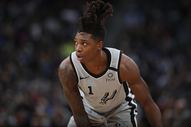 San Antonio Spurs guard Lonnie Walker IV (1) in the second half of an NBA basketball game Monday, Feb.10, 2020, in Denver. The Nuggets won 127-120. (AP Photo/David Zalubowski)