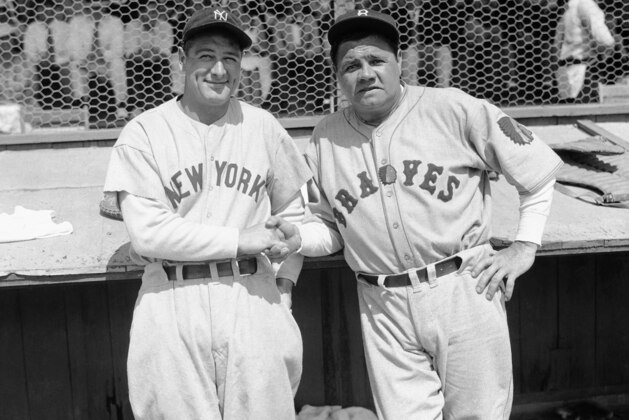 Former New York Yankees teammates Babe Ruth, right, and Lou Gehrig pose together at a spring training game in St. Petersburg, Fla., March 16, 1935 as they met for the first time after Ruth left the Yankees for the Boston Braves.  The Braves defeated the Yankees 3-2 in the exhibition game. (AP Photo/Tom Sande)