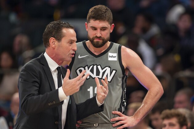 Brooklyn Nets head coach Kenny Atkinson, left, talks with guard Joe Harris (12) in the first half of an NBA basketball game against the New York Knicks, Sunday, Nov. 24, 2019, at Madison Square Garden in New York. (AP Photo/Corey Sipkin).