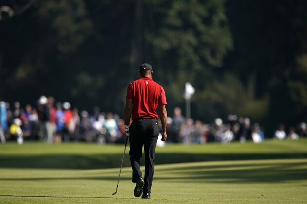 Tiger Woods walks to the green after hitting his third shot on the 11th hole during the final round of the Genesis Invitational golf tournament at Riviera Country Club, Sunday, Feb. 16, 2020, in the Pacific Palisades area of Los Angeles. (AP Photo/Ryan Kang)