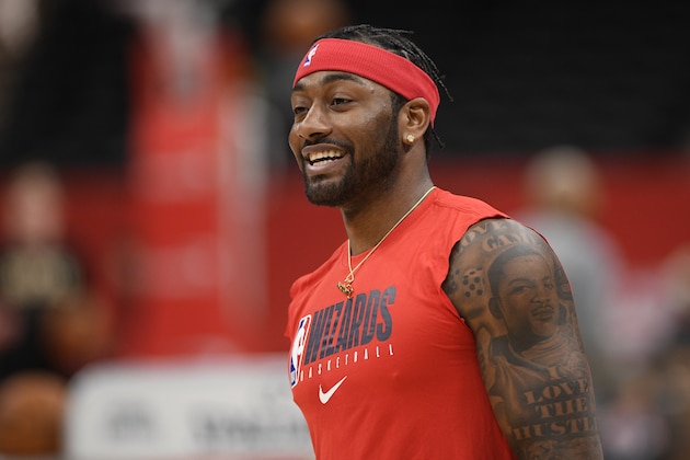 Washington Wizards guard John Wall works out prior to an NBA basketball game against the Milwaukee Bucks, Monday, Feb. 24, 2020, in Washington. (AP Photo/Nick Wass)