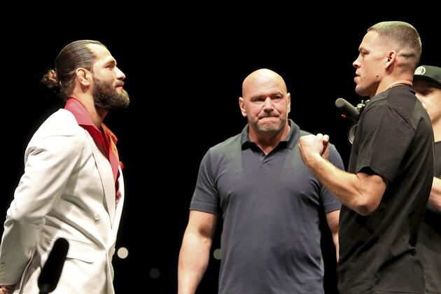FILE - In this Sept. 19, 2019, file photo, Jorge Masvidal, left, squares off with Nate Diaz as UFC President Dana White looks on at a news conference for the UFC 244 mixed martial arts event in New York. Diaz or Masvidal will step out of the Garden on Saturday, Nov. 2, the undisputed champ of UFC 244's crudest named title _ the Baddest Mother (censored!) in the game. (AP Photo/Gregory Payan, File) FILE - In this Sept. 19, 2019, file photo, Jorge Masvidal, left, squares off with Nate Diaz as UFC President Dana White looks on at a news conference for the UFC 244 mixed martial arts event in New York. Diaz or Masvidal will step out of the Garden on Saturday, Nov. 2, the undisputed champ of UFC 244's crudest named title _ the Baddest Mother (censored!) in the game. (AP Photo/Gregory Payan, File)