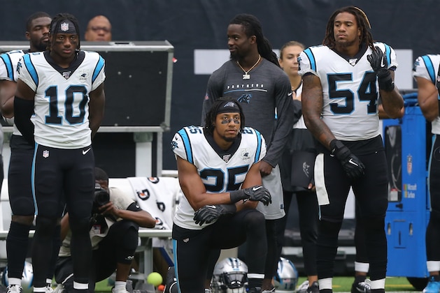 HOUSTON, TEXAS - SEPTEMBER 29: Eric Reid #25 of the Carolina Panthers kneels during the national anthem before playing the Houston Texans at NRG Stadium on September 29, 2019 in Houston, Texas. (Photo by Bob Levey/Getty Images)