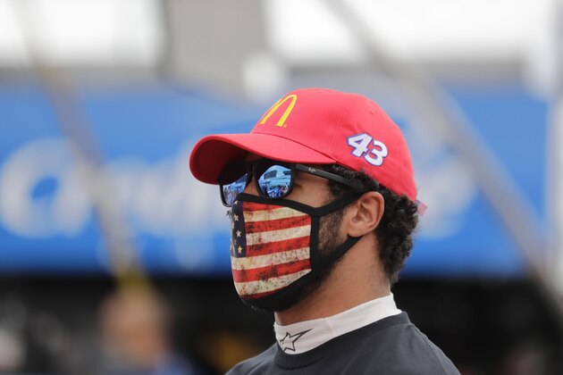 Bubba Wallace (43) on pit row before a NASCAR Cup Series auto race at Atlanta Motor Speedway on Sunday, June 7, 2020, in Hampton, Ga. (AP Photo/Brynn Anderson)