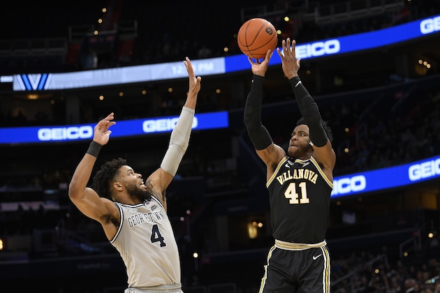Villanova forward Saddiq Bey (41) shoots over Georgetown guard Jagan Mosely (4) during the first half of an NCAA college basketball game, Saturday, March 7, 2020, in Washington. (AP Photo/Nick Wass)
