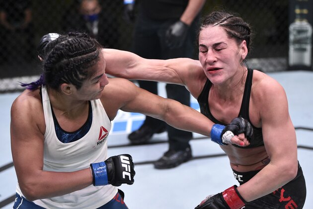 LAS VEGAS, NEVADA - JUNE 13: (L-R) Cynthia Calvillo punches Jessica Eye in their flyweight fight during the UFC Fight Night event at UFC APEX on June 13, 2020 in Las Vegas, Nevada. (Photo by Chris Unger/Zuffa LLC)