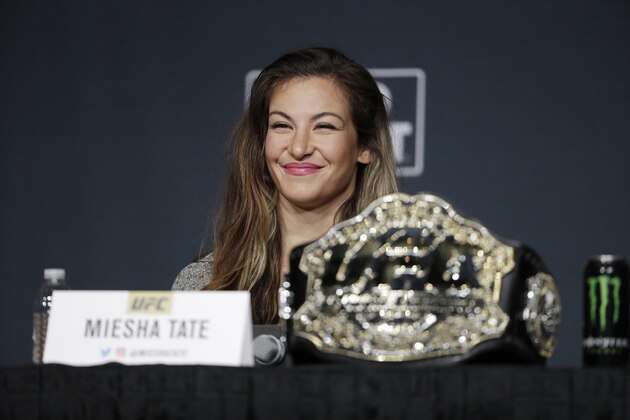 Miesha Tate smiles during a UFC 200 mixed martial arts news conference, Wednesday, July 6, 2016, in Las Vegas. Tate is scheduled to fight Amanda Nunes in a women’s bantamweight championship fight at UFC 200 on Saturday. (AP Photo/John Locher)