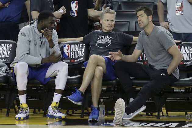 Golden State Warriors general manager Bob Myers, right, talks with forward Draymond Green, left, and head coach Steve Kerr during a team practice in Oakland, Calif., Wednesday, June 12, 2019. The Warriors are scheduled to play the Toronto Raptors in Game 6 of basketball's NBA Finals on Thursday. (AP Photo/Jeff Chiu)