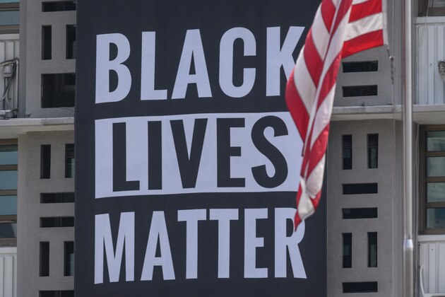 A 'Black Lives Matter' banner is displayed on the US embassy in Seoul on June 14, 2020. - The US embassy in South Korea expressed its support for the Black Lives Matter movement with a large banner outside its building as anti-racism protests sweep America and the world following the death of George Floyd. (Photo by Ed JONES / AFP) (Photo by ED JONES/AFP via Getty Images)