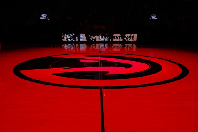 ATLANTA, GA - FEBRUARY 22: The Atlanta Hawks logo at mid court is lit in red prior to an NBA game against the Dallas Mavericks at State Farm Arena on February 22, 2020 in Atlanta, Georgia. NOTE TO USER: User expressly acknowledges and agrees that, by downloading and/or using this photograph, user is consenting to the terms and conditions of the Getty Images License Agreement. (Photo by Todd Kirkland/Getty Images)
