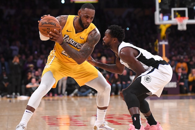 LOS ANGELES, CA - DECEMBER 25: Patrick Beverley #21 of the Los Angeles Clippers guards LeBron James #23 of the Los Angeles Lakers in the second half of the game at Staples Center on December 25, 2019 in Los Angeles, California. NOTE TO USER: User expressly acknowledges and agrees that, by downloading and/or using this Photograph, user is consenting to the terms and conditions of the Getty Images License Agreement. (Photo by Jayne Kamin-Oncea/Getty Images)