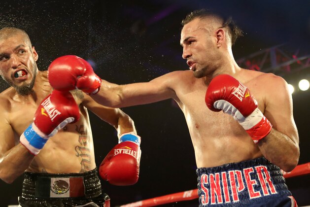 KISSIMMEE, FL - MAY 25: Jose Pedraza punches Antonio Lozada Jr. during their WBO Latino Title fight at Osceola Heritage Park on May 25, 2019 in Kissimmee, Florida. (Photo by Alex Menendez/Getty Images) KISSIMMEE, FL - MAY 25: Jose Pedraza punches Antonio Lozada Jr. during their WBO Latino Title fight at Osceola Heritage Park on May 25, 2019 in Kissimmee, Florida. (Photo by Alex Menendez/Getty Images)
