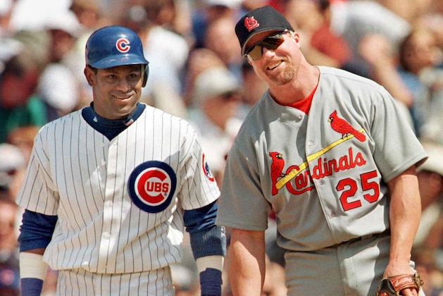The Chicago Cubs' Sammy Sosa stands with St. Louis Cardinal's first baseman Mark McGwire between pitches after Sosa singled in the second inning 28 May, 1999, at Wrigley Field in Chicago, Illinois. It was the first time the pair had played each other since last year's home run race. The Cubs won 6-3 with help from a home run from Sosa. AFP PHOTO/John ZICH (Photo by JOHN ZICH / AFP) (Photo credit should read JOHN ZICH/AFP via Getty Images) The Chicago Cubs' Sammy Sosa stands with St. Louis Cardinal's first baseman Mark McGwire between pitches after Sosa singled in the second inning 28 May, 1999, at Wrigley Field in Chicago, Illinois. It was the first time the pair had played each other since last year's home run race. The Cubs won 6-3 with help from a home run from Sosa. AFP PHOTO/John ZICH (Photo by JOHN ZICH / AFP) (Photo credit should read JOHN ZICH/AFP via Getty Images)